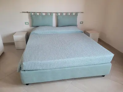 Letto o letti in una camera di Villa Piscinas