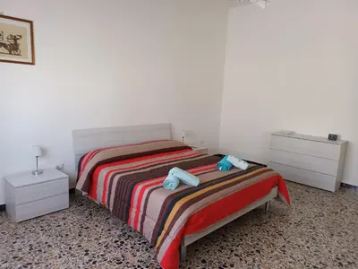 Letto o letti in una camera di Casa Bellini Oristano