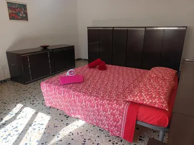 Letto o letti in una camera di Casa Bellini Oristano