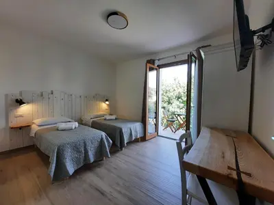 Letto o letti in una camera di Affittacamere Su Maistu e Linna