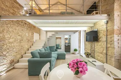Area soggiorno di Adriana's New Loft