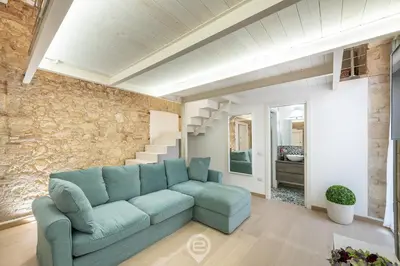 Area soggiorno di Adriana's New Loft