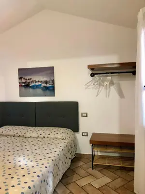 Letto o letti in una camera di Villetta il Carrubo vista mare