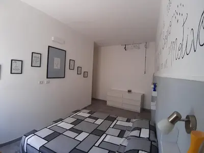 Letto o letti in una camera di CASA ALEXSA Intero appartamento o CAMERA ALEXSA Camera matrimoniale con patio