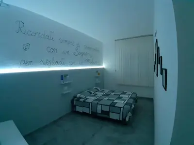 Letto o letti in una camera di CASA ALEXSA Intero appartamento o CAMERA ALEXSA Camera matrimoniale con patio