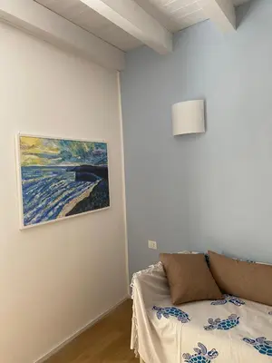 Letto o letti in una camera di Le Vele Carloforte