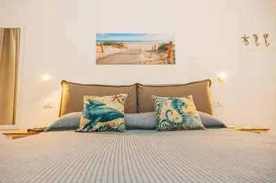 Letto o letti in una camera di Il Sogno Casa Vacanze 2