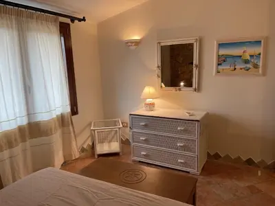 Letto o letti in una camera di Casa Ada Chia
