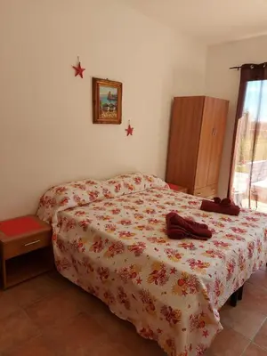 Letto o letti in una camera di STELLA MARINA - IUN Q4042