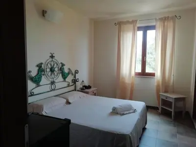 Letto o letti in una camera di S'ena Hotel