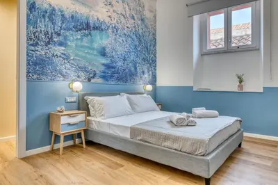 Letto o letti in una camera di IzzHome Corso76