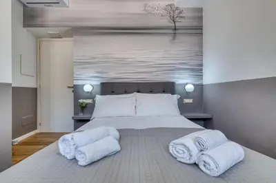 Letto o letti in una camera di IzzHome Corso76