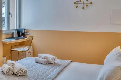 Letto o letti in una camera di IzzHome Corso76