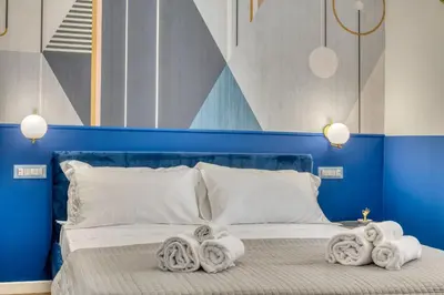 Letto o letti in una camera di IzzHome Corso76