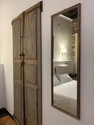 Letto o letti in una camera di C&O Savoia Deluxe Rooms