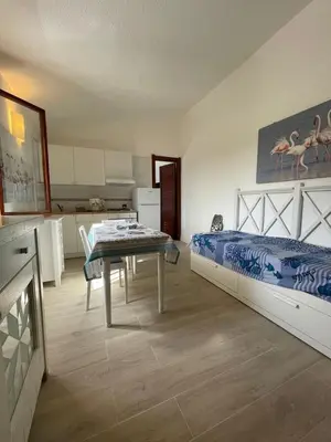 Letto o letti in una camera di Villetta Azzurra Kal'è Moru