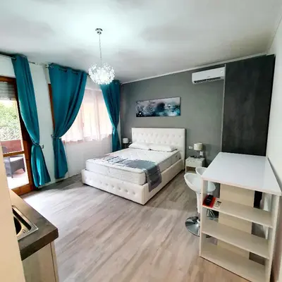 Letto o letti in una camera di Villa Volta 2 Policlinico Monserrato