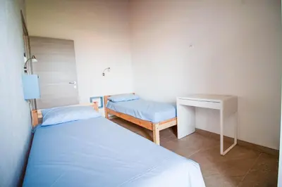 Letto o letti in una camera di DOMEK Villa a 100mt dalla spiaggia