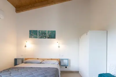 Letto o letti in una camera di DOMEK Villa a 100mt dalla spiaggia