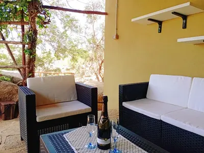 Area soggiorno di Villa Milena Villasimius, WiFi gratuito, Ampio Giardino a 300 m dal Mare