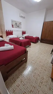 Letto o letti in una camera di Hotel Soleo