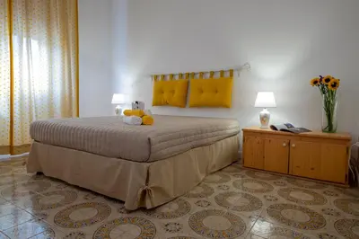 Letto o letti in una camera di Hotel Soleo