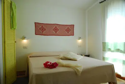 Letto o letti in una camera di Is Cannisonis
