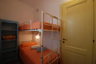 Letto o letti in una camera di Is Cannisonis