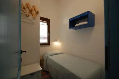 Letto o letti in una camera di Is Cannisonis