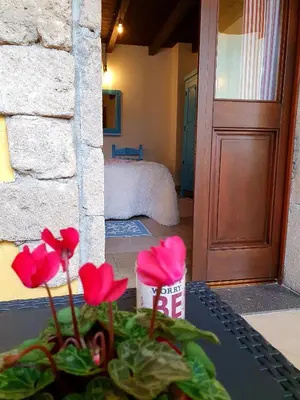 Letto o letti in una camera di Palmas Anna's rooms Is Procilis