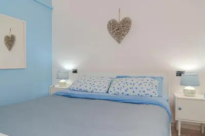Letto o letti in una camera di Casa Ester