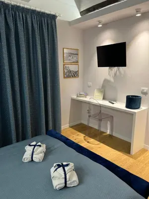 Letto o letti in una camera di Antica dimora lamarmora