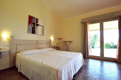 Letto o letti in una camera di Affittacamere B&B La Villa dei Graniti