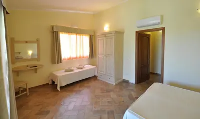 Letto o letti in una camera di Affittacamere B&B La Villa dei Graniti
