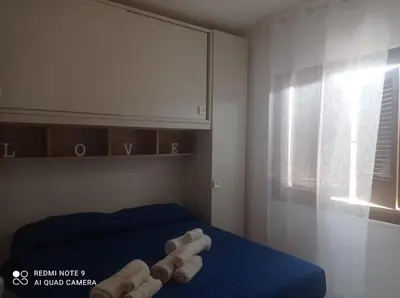 Letto o letti in una camera di Tortolì-Porto Frailis-Arbatax