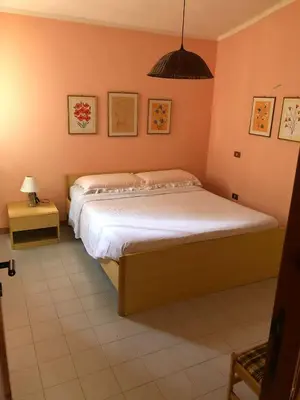 Letto o letti in una camera di Villetta Pinus Village, Chia, Sardegna 30 metri dal mare