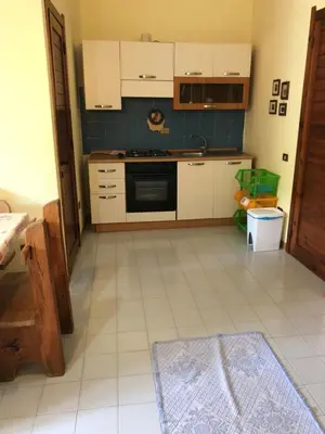 Cucina o angolo cottura di Villetta Pinus Village, Chia, Sardegna 30 metri dal mare
