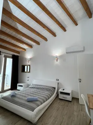 Letto o letti in una camera di L’ANGELO BIANCO