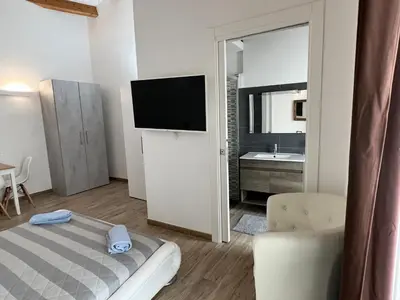 Letto o letti in una camera di L’ANGELO BIANCO