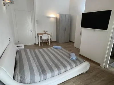 Letto o letti in una camera di L’ANGELO BIANCO