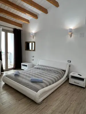 Letto o letti in una camera di L’ANGELO BIANCO