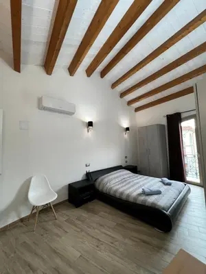 Letto o letti in una camera di L’ANGELO BIANCO 2