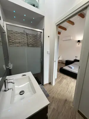 Letto o letti in una camera di L’ANGELO BIANCO 2