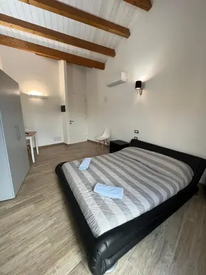 Letto o letti in una camera di L’ANGELO BIANCO 2