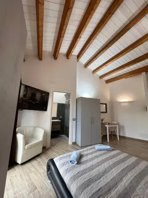 Letto o letti in una camera di L’ANGELO BIANCO 2