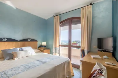 Letto o letti in una camera di Hotel Villa del Mare Solanas