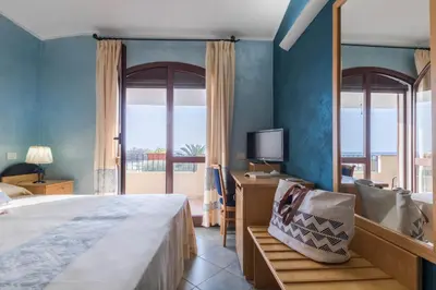 Letto o letti in una camera di Hotel Villa del Mare Solanas