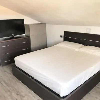 Letto o letti in una camera di Appartamento L’Angelica