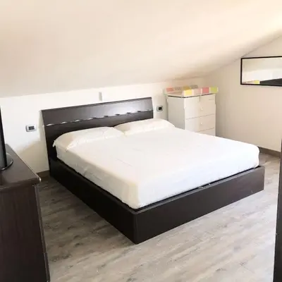 Letto o letti in una camera di Appartamento L’Angelica