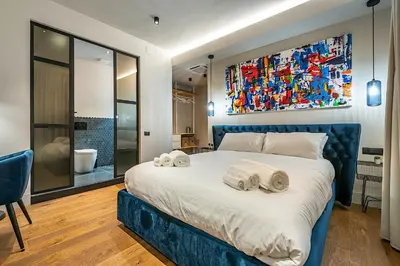 Letto o letti in una camera di VicomilleSuites Cagliari Adults-Only